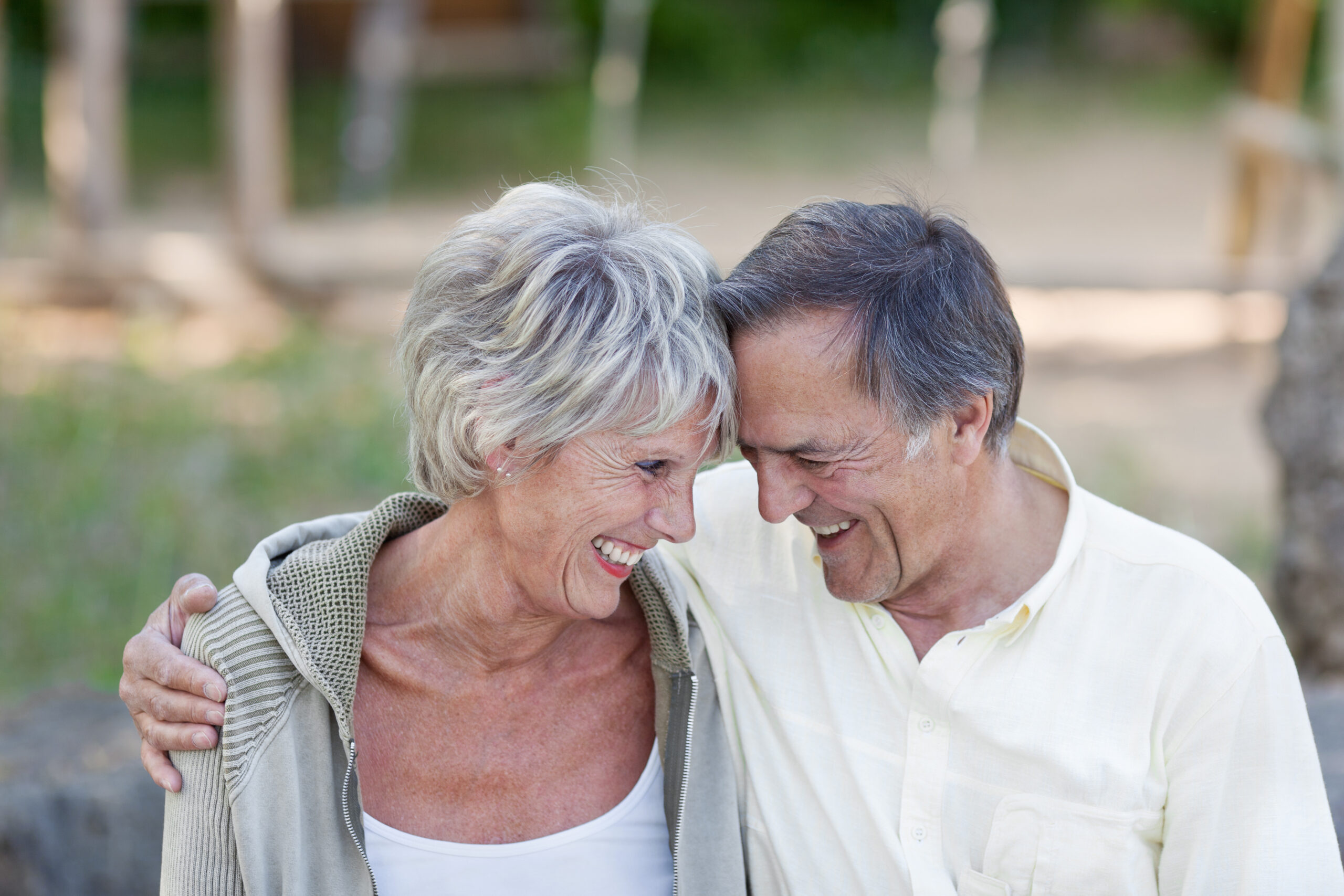 middle-aged couple share embrace