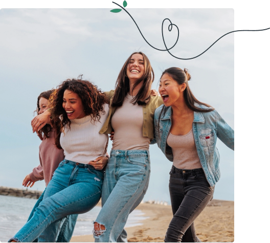 Women walking together on the beach
